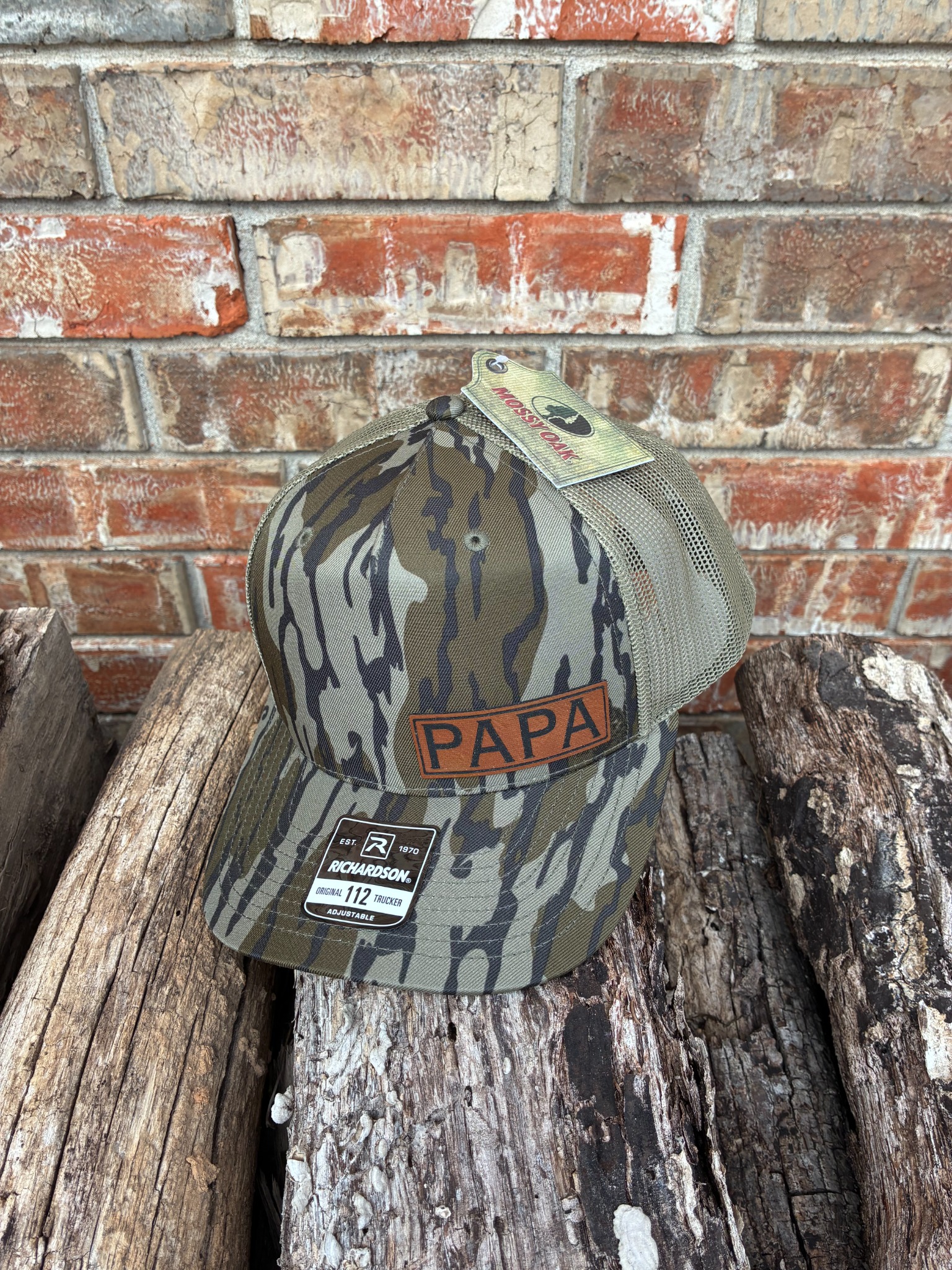 Camouflage Richardson 112 trucker cap with a custom Papa leatherette patch
